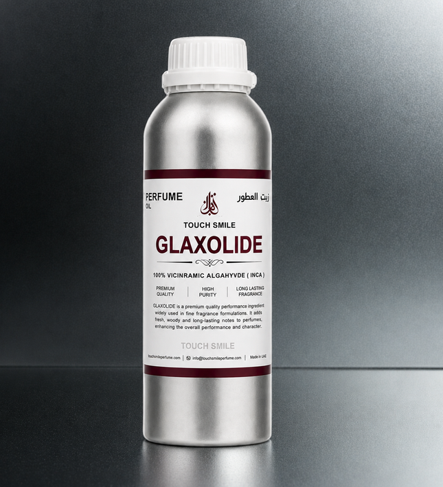 A silver aluminum bottle of Glaxolide perfume oil with a white cap, set against a dark gray gradient background.