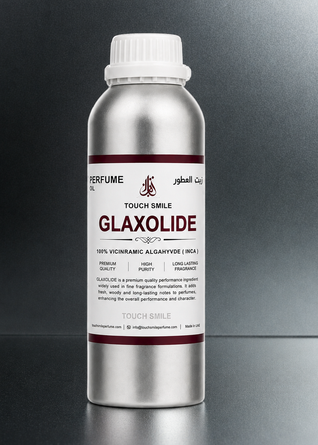 A silver aluminum bottle of Glaxolide perfume oil with a white cap, set against a dark gray gradient background.