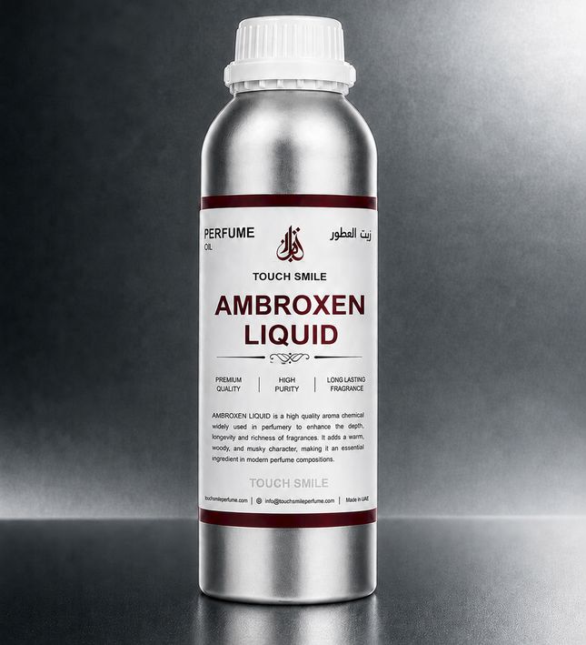 A silver metal bottle of Touch Smile Ambroxen Liquid perfume oil with a white cap, set against a dark gray gradient background.
